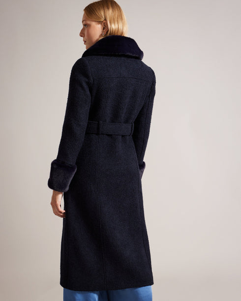 LYDDIIA-Outerwear-Introducing the ultimate cosy coat. LYDDIIA is your stylish shield against the elements. Slip into the regular fit adorned with faux fur cuffs and collar for an extra touch of glam. The button fastening and belted waist create a chic silhouette, while pockets keep your hands toasty. Longline coat Regular fit Faux fur cuffs and collar Button fastening Belted waist Pockets Jara is 5'10.5" / 1.79m and wears Dark Blue in a Ted size 1- Ted Baker Romania